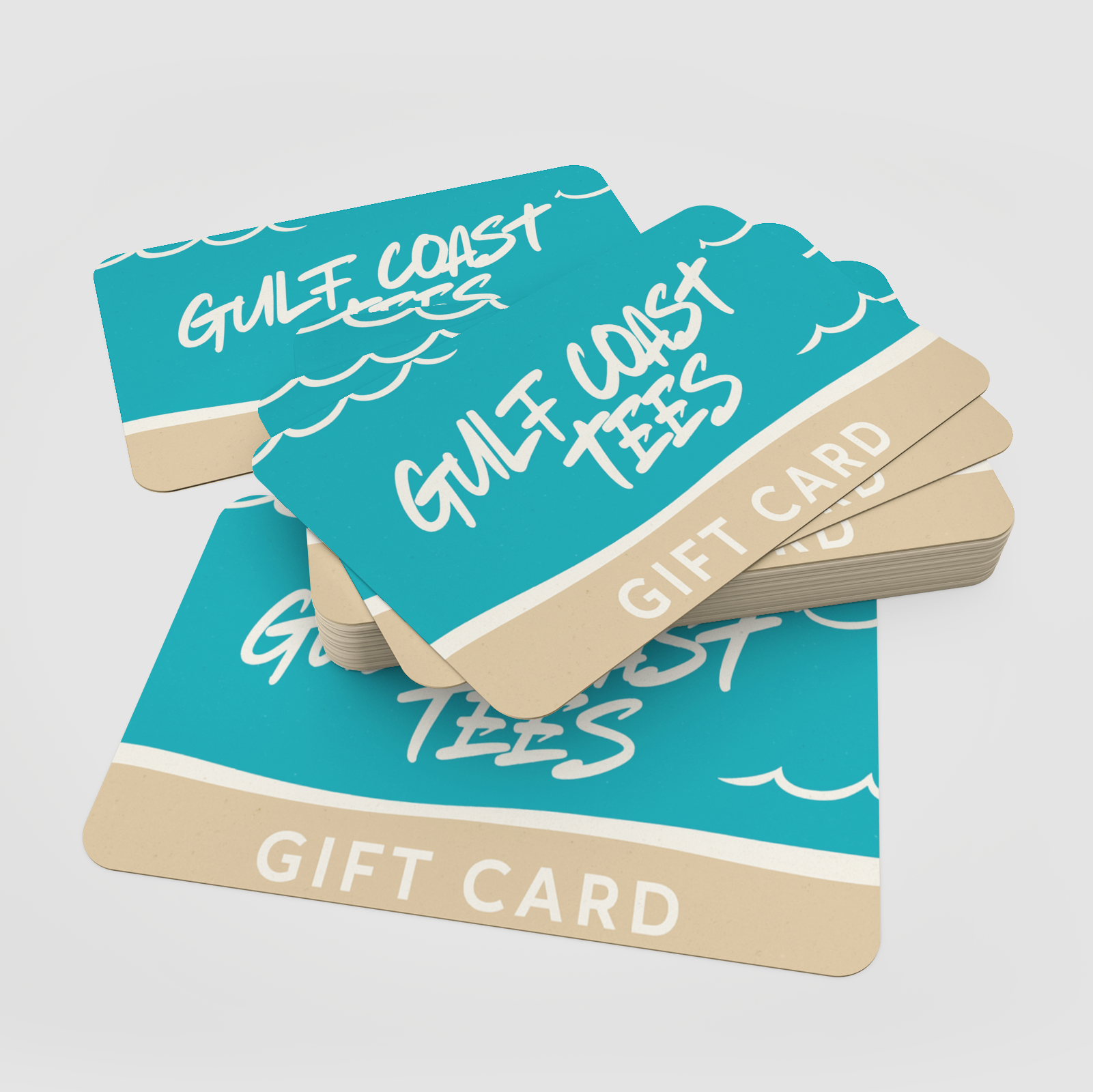Stack of 'Gulf Coast Tees' gift cards on a light gray background
