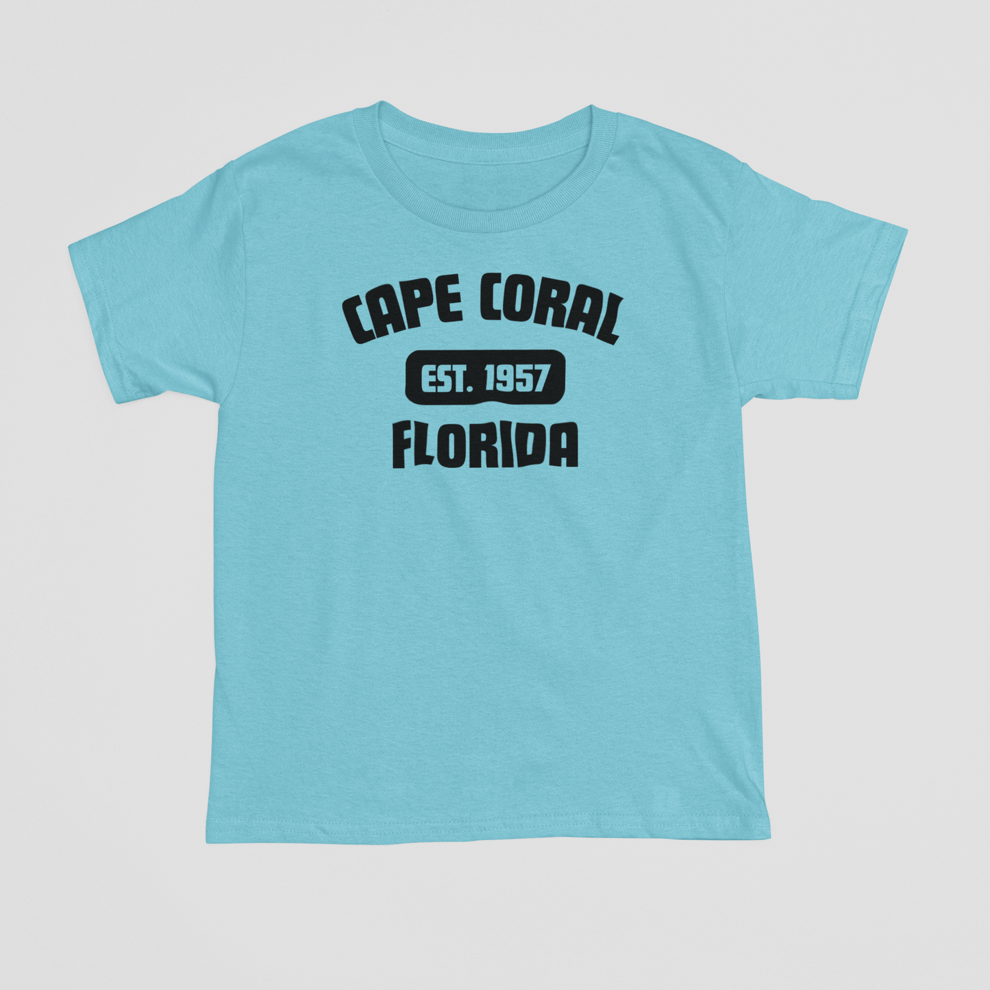 Light blue t-shirt with 'Cape Coral, Florida' text on a light gray background