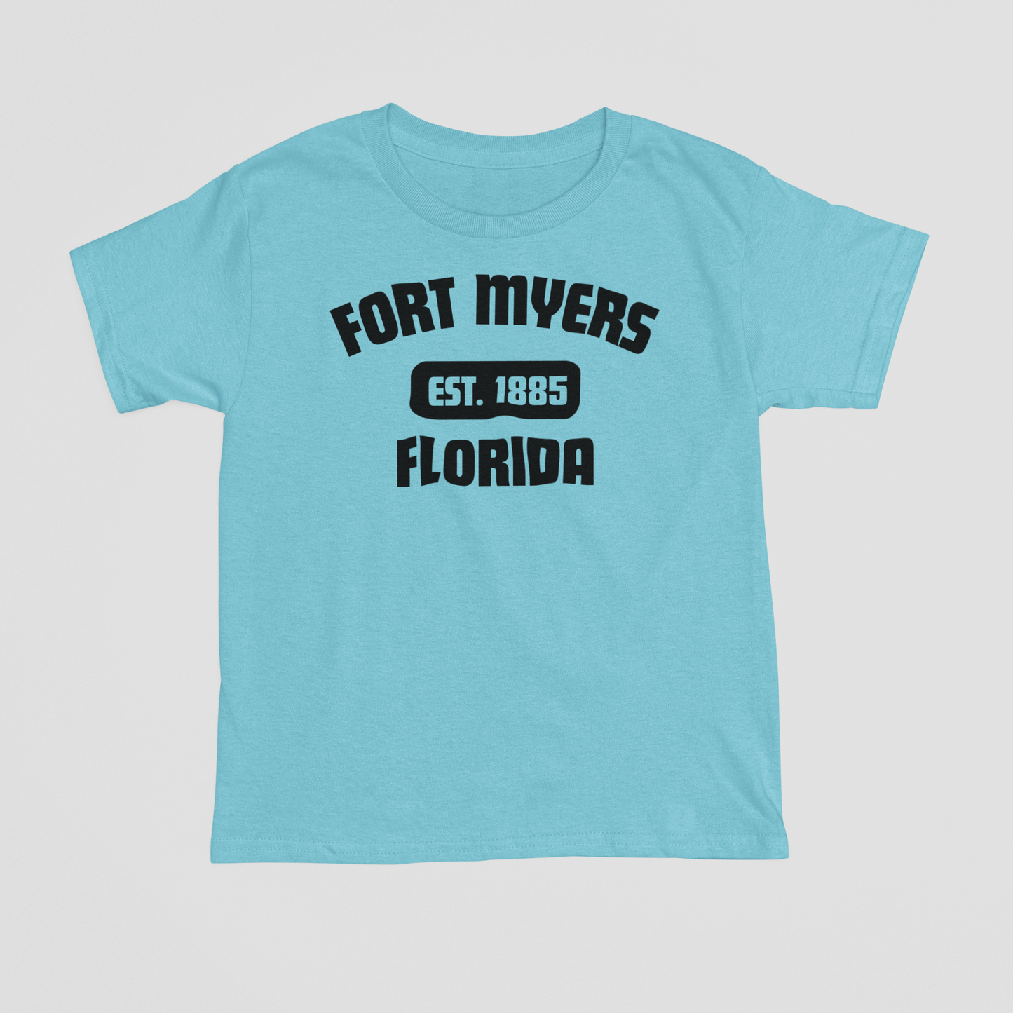 Light blue t-shirt with black text 'FORT MYERS FLORIDA' on a light gray background