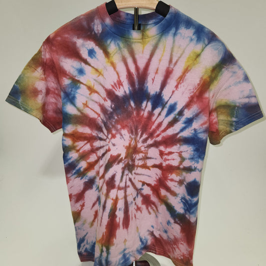 Tie-dye t-shirt with a colorful spiral pattern on a white background